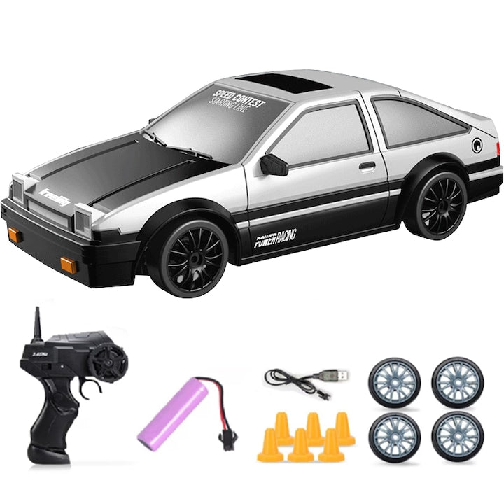Masina de drift telecomandata ZOUN stil AE86 telecomanda 2 4G cu anvelope interschimbabile blocaje rutiere incarcare USB scara 1:24 20 km/h tractiune integrala alb/negru